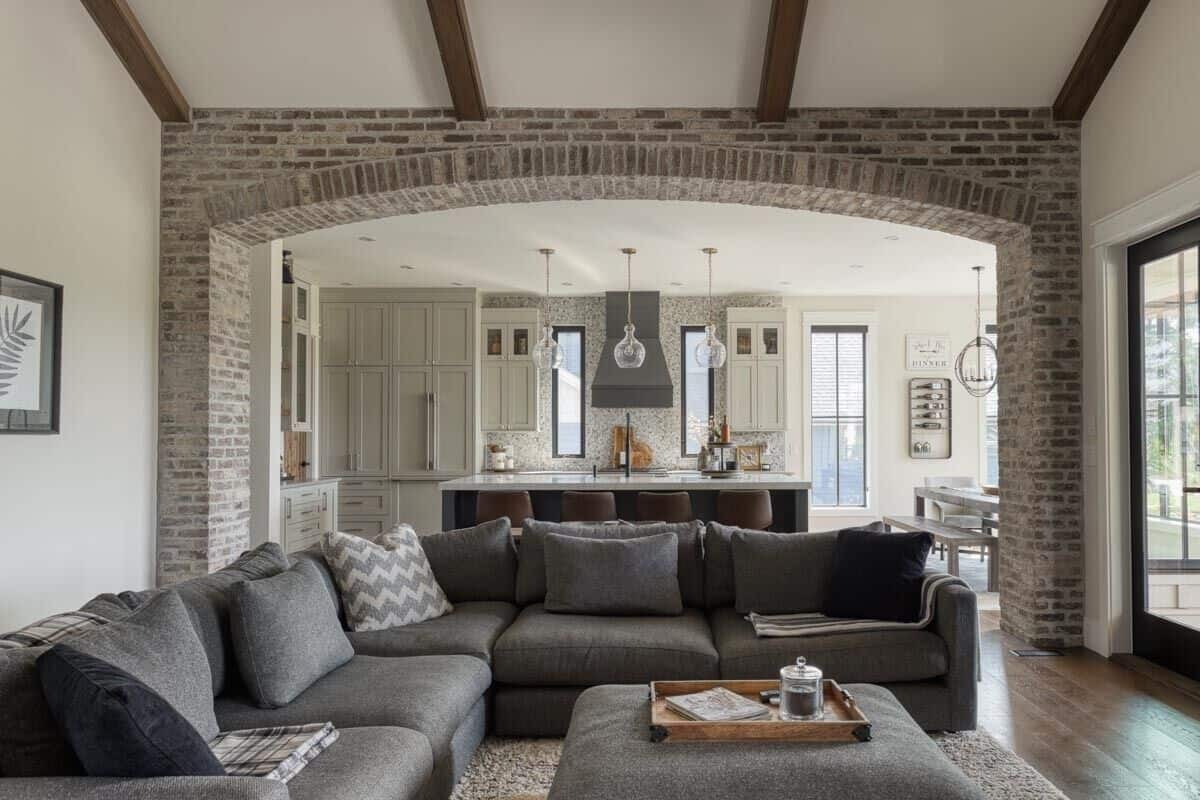 A brick archway connects the great room and kitchen together.