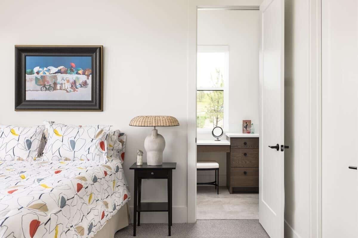 Secondary bedroom with a carpeted floor and an ensuite bathroom.