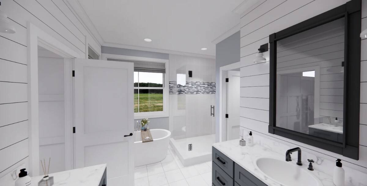 The primary bathroom includes a soaking tub brightened by a picture window.