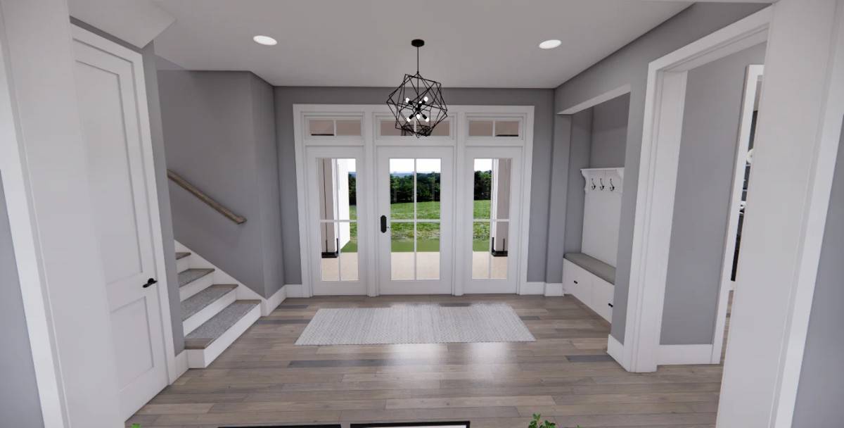 Foyer with a glazed front door, a geometric chandelier, and a beige rug that lays on the hardwood floor.