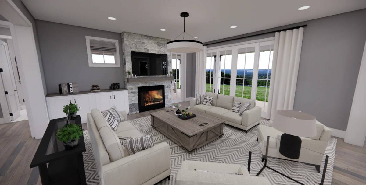 The great room includes beige seats and a stone fireplace with a TV on top.