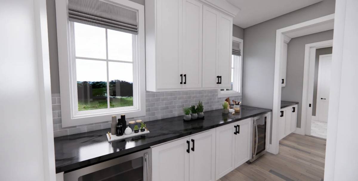 Prep kitchen with white cabinets, a marble countertop, and multiple wine fridges.