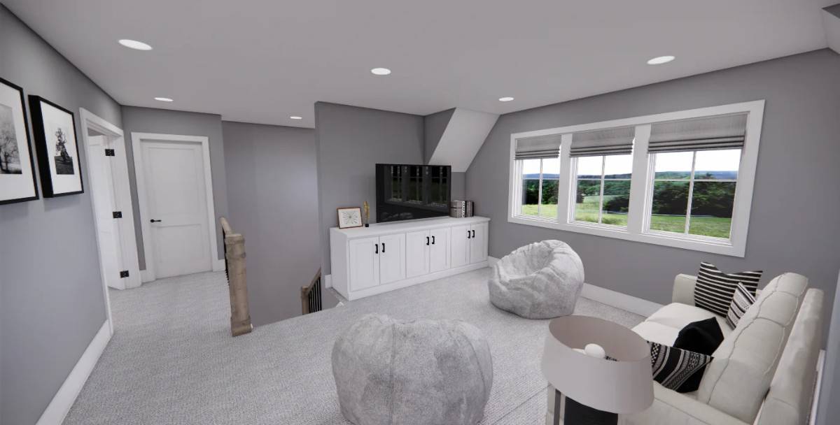 Loft with a beige sofa, bean chairs, and a TV sitting on the white cabinet.