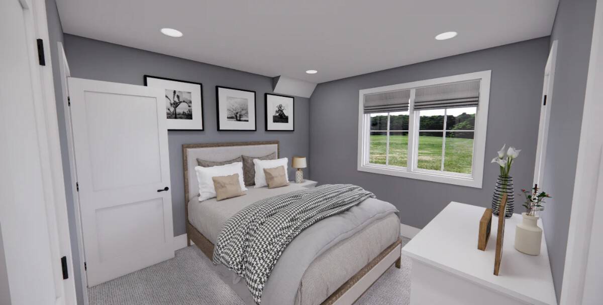 Secondary bedroom with a wooden bed and gray walls adorned with framed artworks.