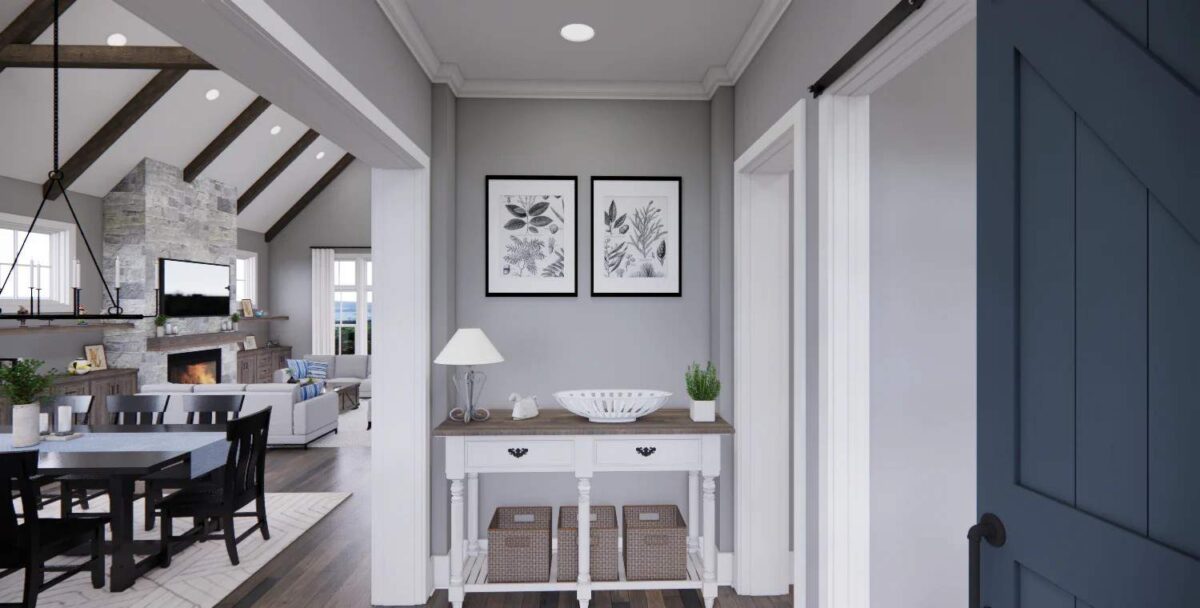 Foyer with a wooden console table topped with a decorative bowl and floral artworks.