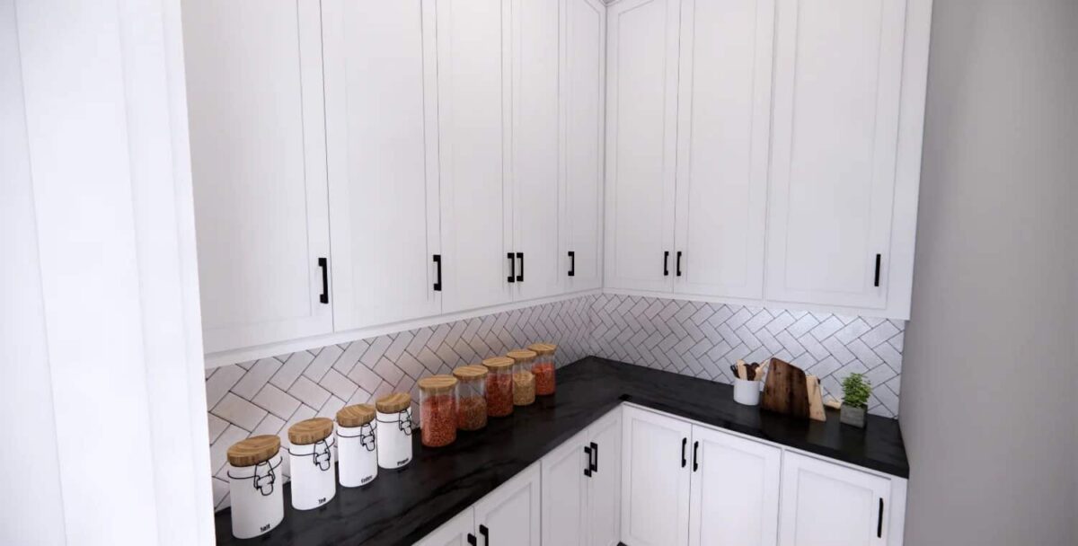 Walk-in pantry with white cabinets and contrasting countertops.