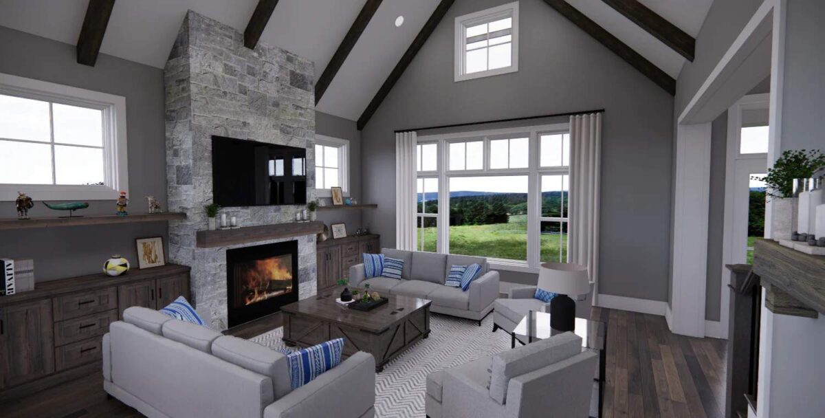 Great room with gray sofas and a stone fireplace topped with a TV.