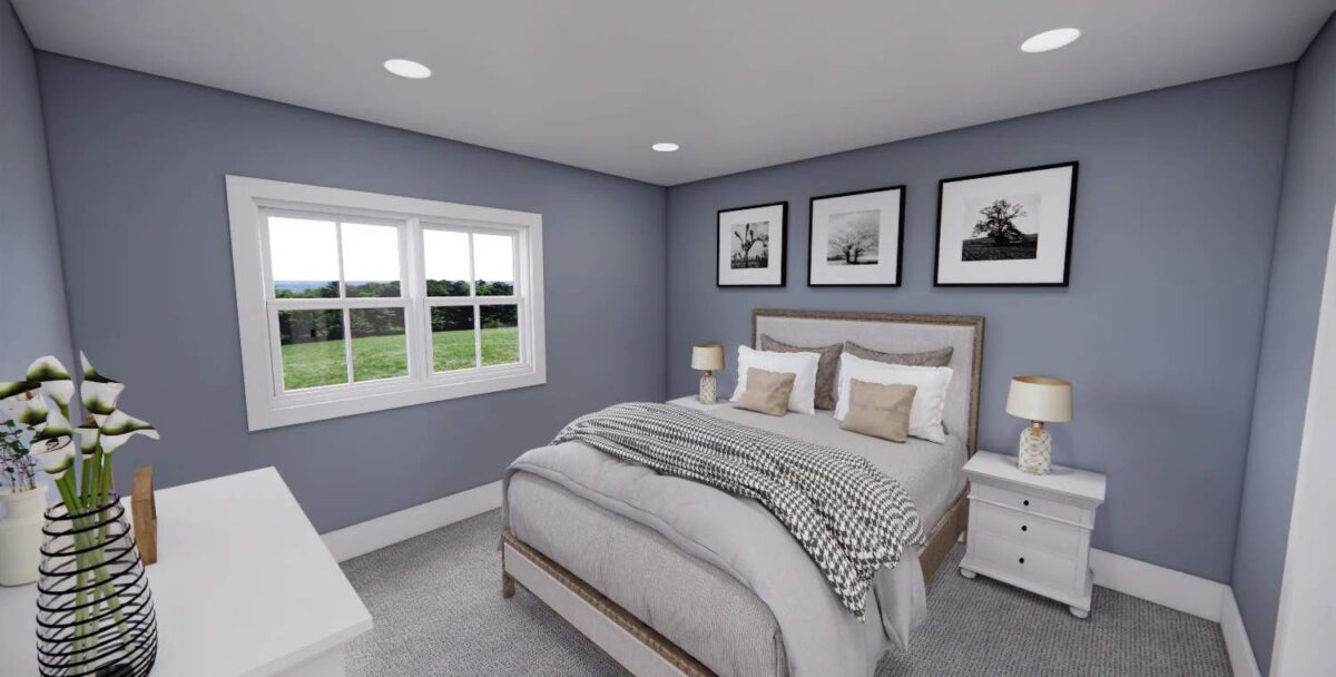 Secondary bedroom with light blue walls, a carpeted floor, and a wooden complemented with white cabinets.