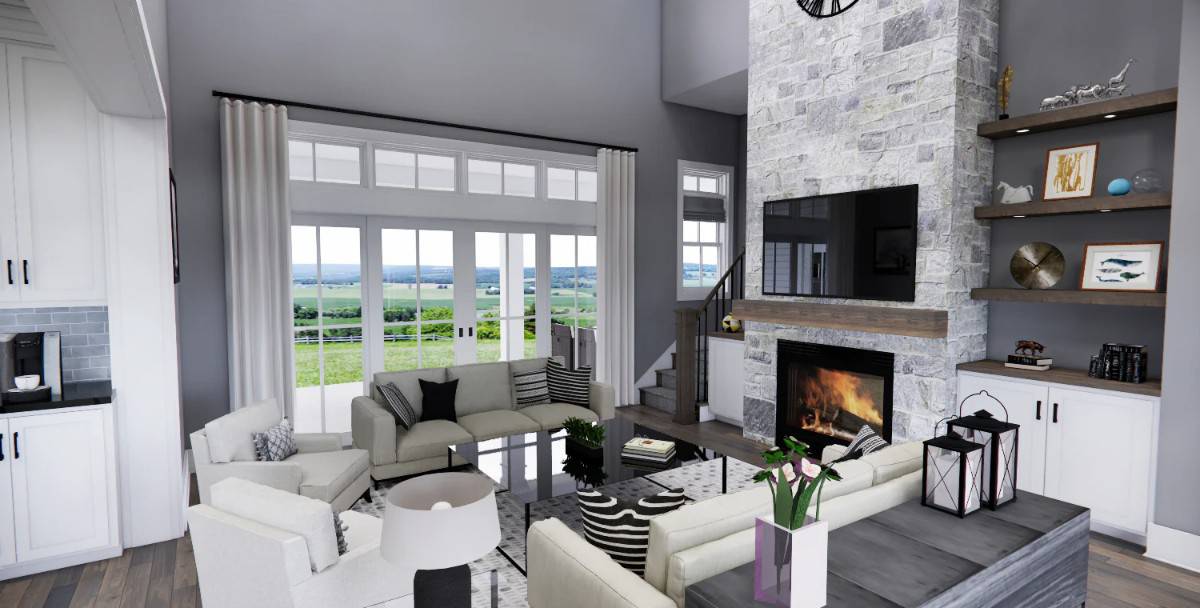 Great room with neutral seats, and a stone fireplace topped with a TV.