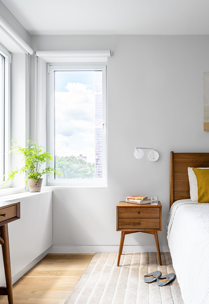 Side table and window in 4-bedroom, 2,500 sq ft mid-century modern NYC apartment