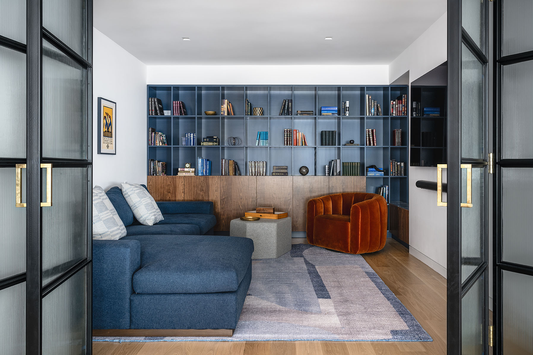 After custom den design in 2,500 sq ft mid-century modern apartment in NYC