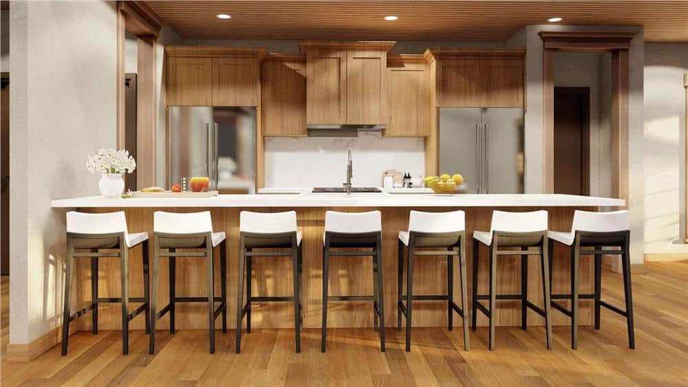 Kitchen with stainless steel appliances, a peninsula bar, and wooden cabinets that blend in with the hardwood floor.