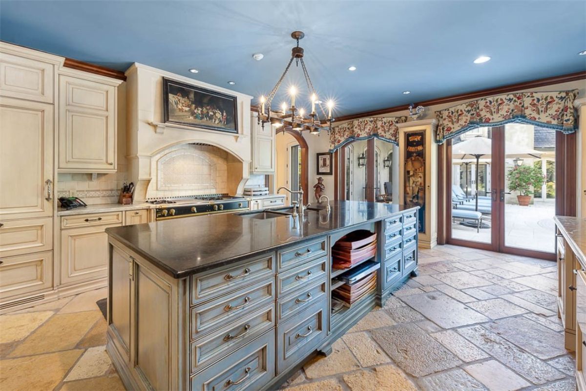 Kitchen with a large island and custom cabinets.