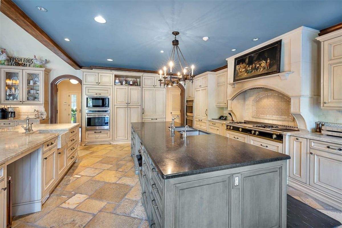 Kitchen with a large island and custom cabinets.