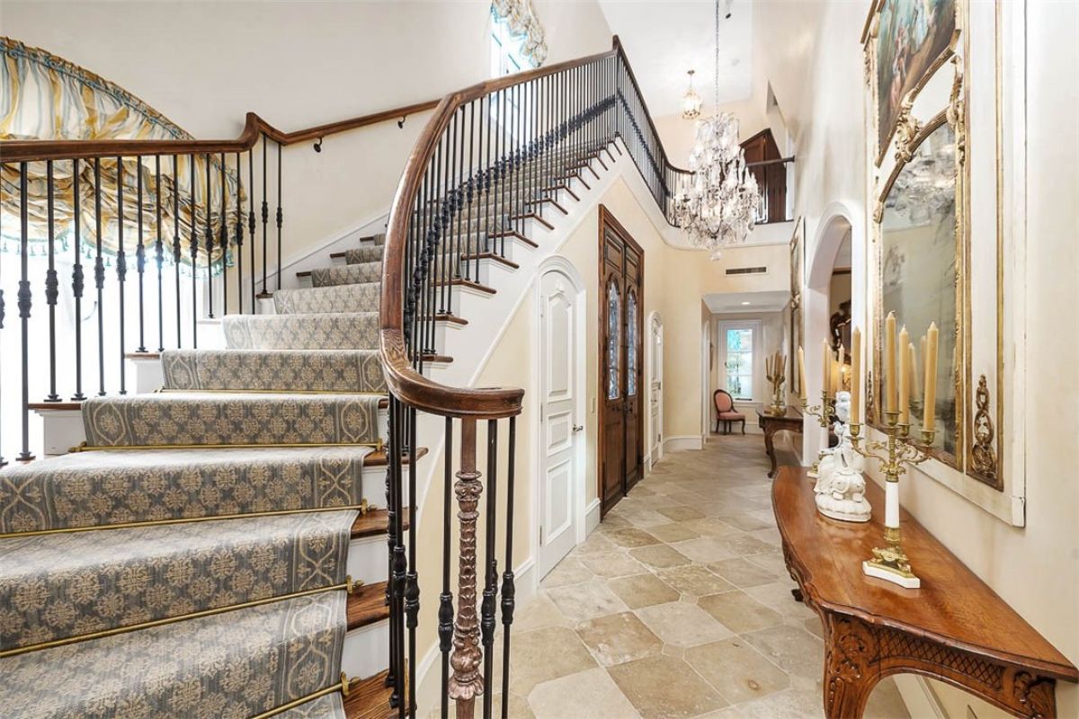 Entrance hall features the stairs and an entryway table.