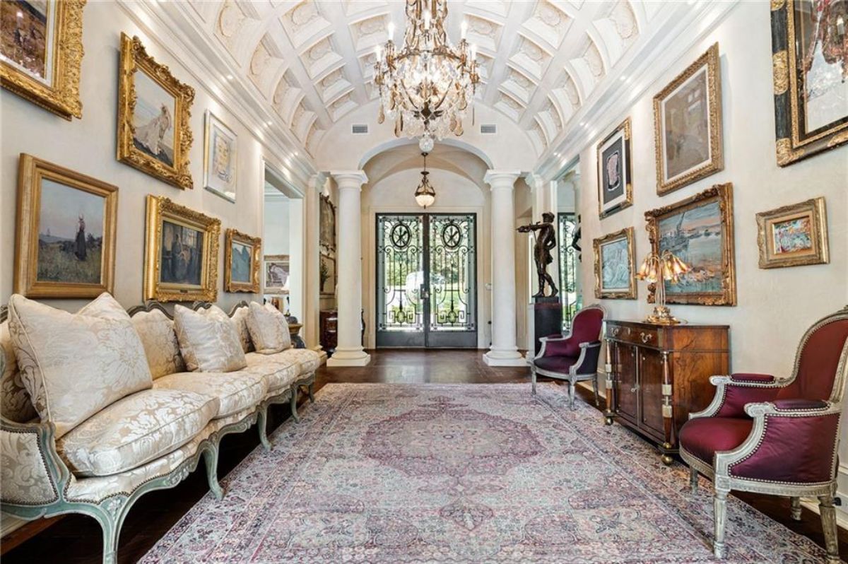 Entrance hall of the mansion, features the couch and the art gallery in the wall. 