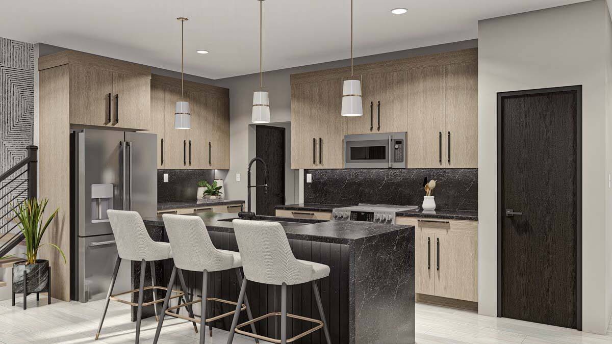 Kitchen with wooden cabinets, modern appliances, and a waterfall island with seating for three.