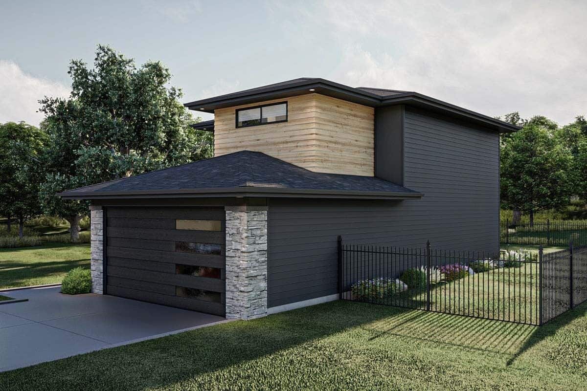 Front-right view showcasing the 2-car garage and concrete driveway.