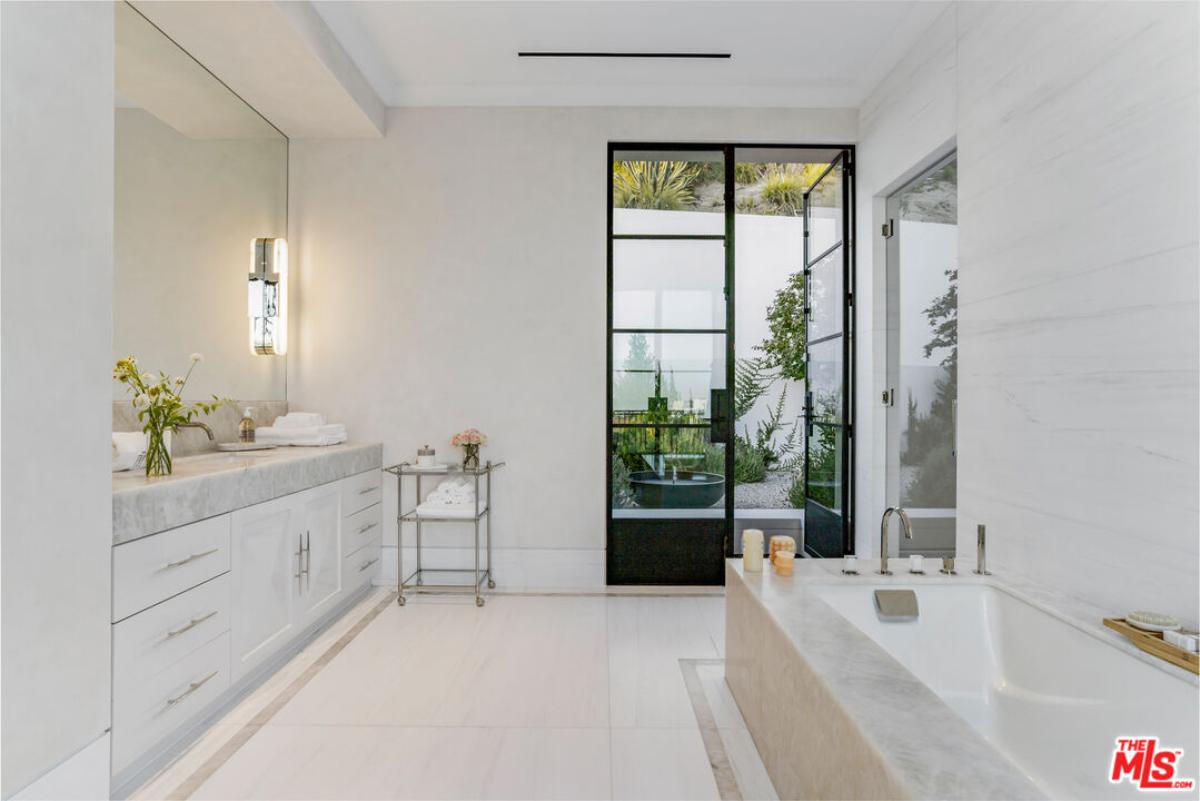 Bathroom with soaking tub and a sink.