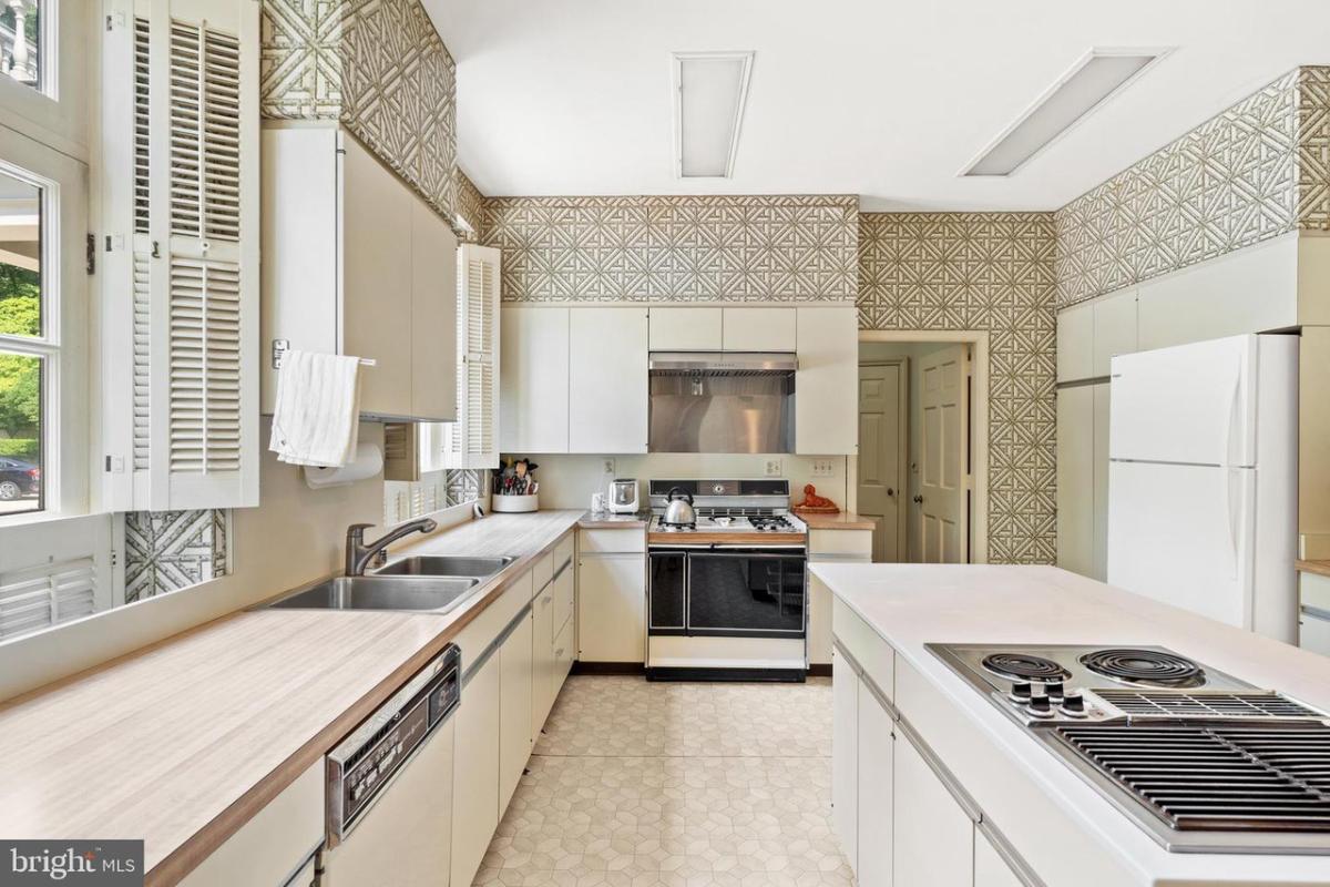 Kitchen with custom cabinets and a cooking area.