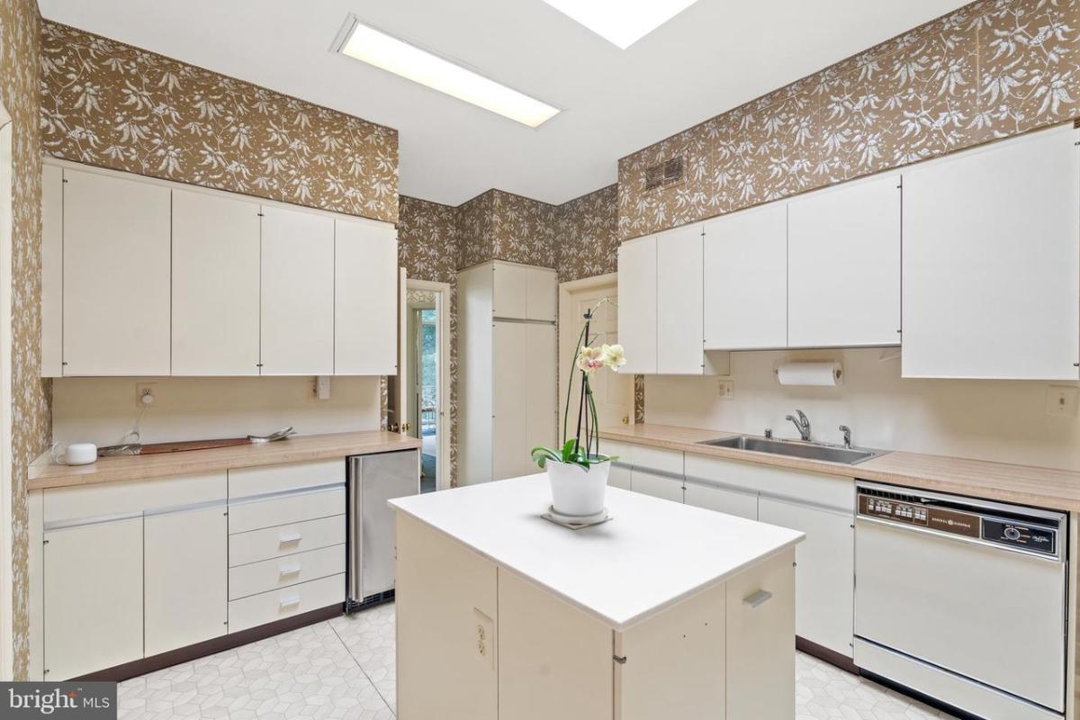 Kitchen with custom cabinets and skylights.