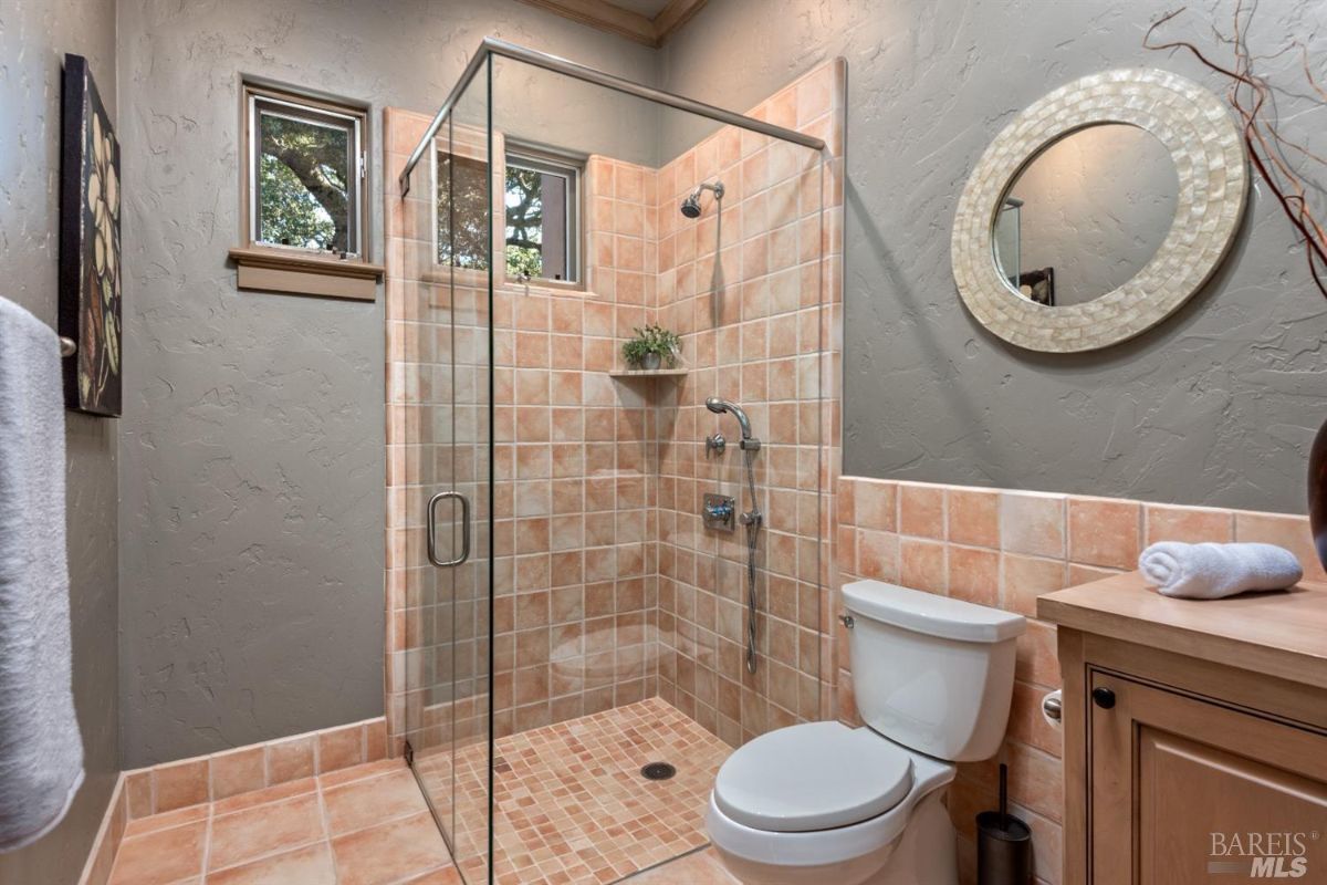 Bathroom with a walk-in shower and a toilet.