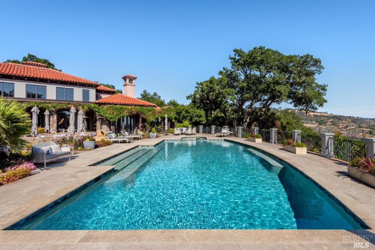 Pool with lounge chairs.