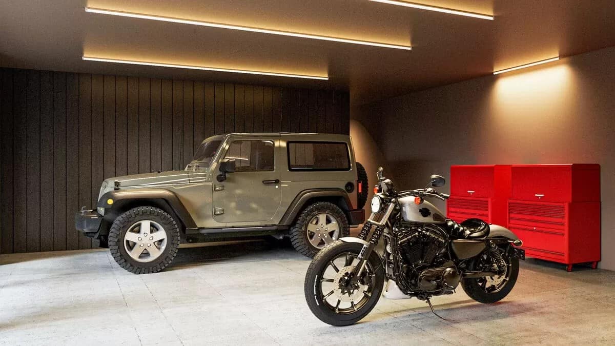 Garage with concrete flooring and a beadboard accent wall.