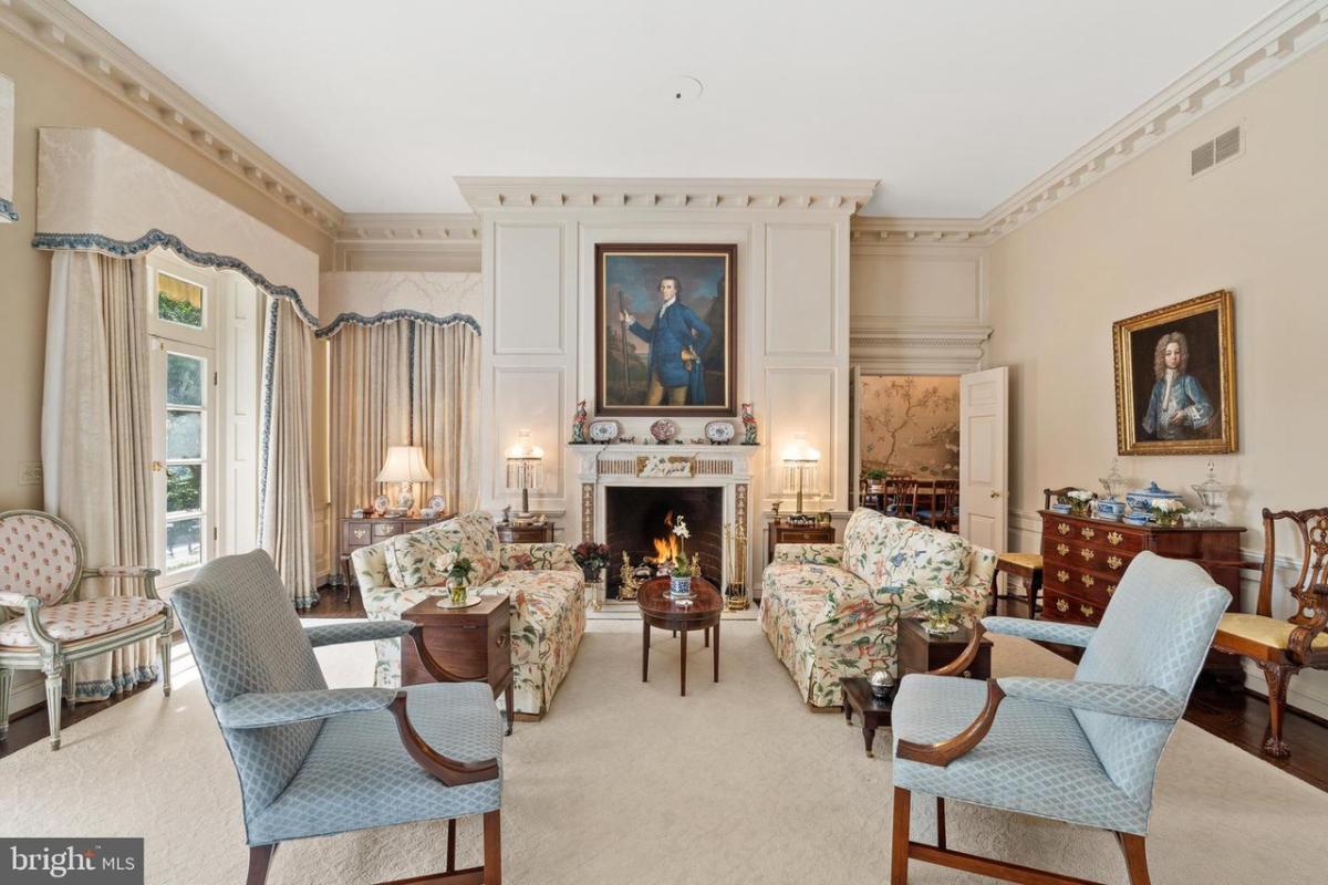 Living room with French doors and a fireplace.