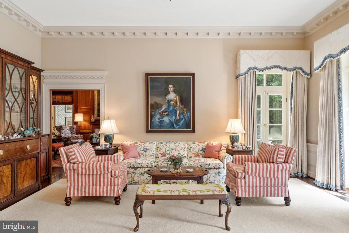 Living room with French doors and couches.