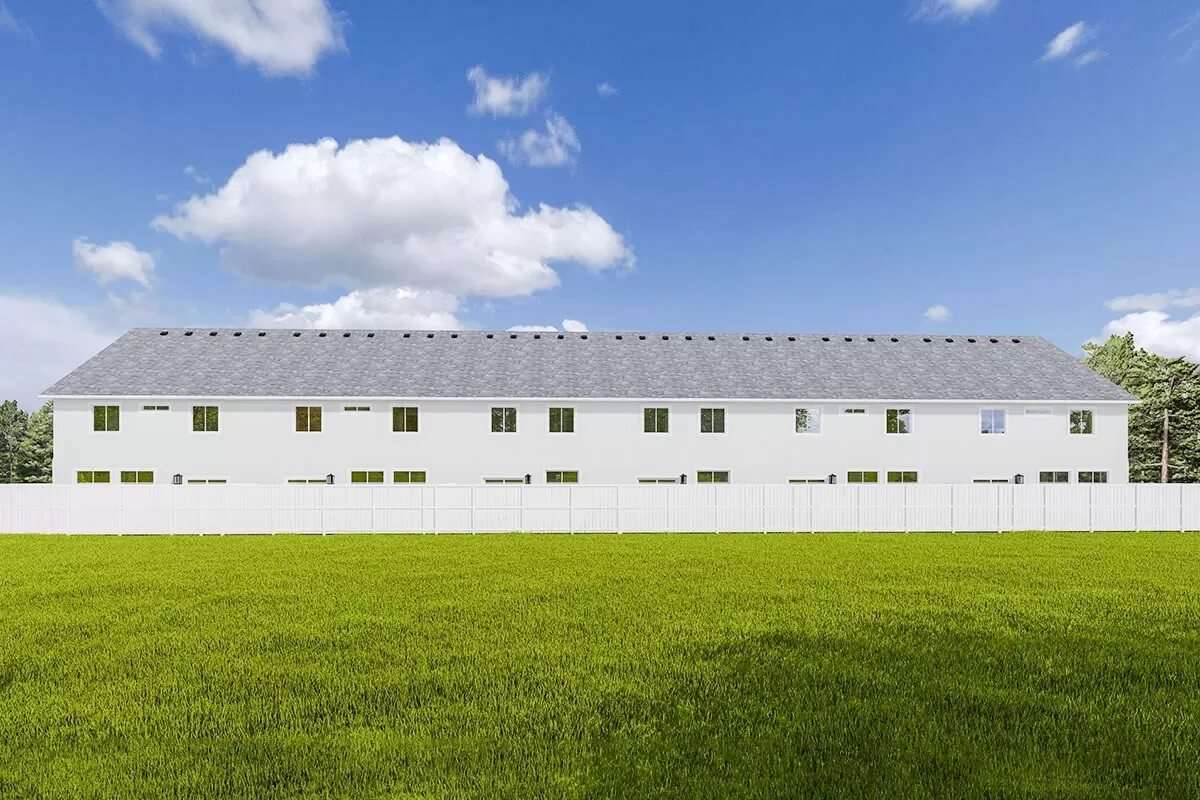 Rear view of the house with plenty of windows and open patios.