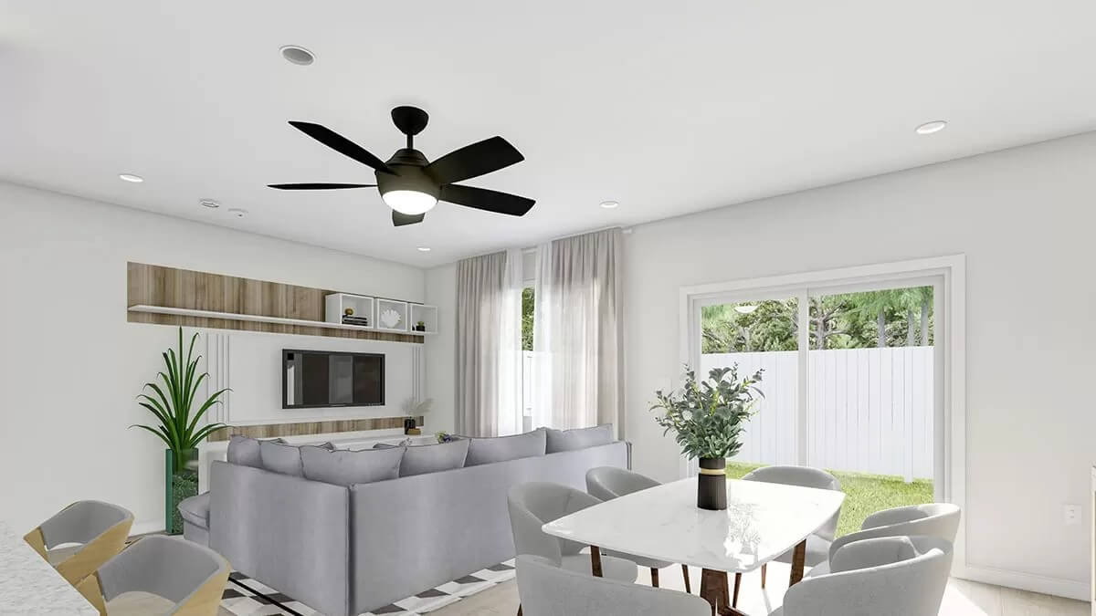 Dining area and great room under a regular white ceiling.