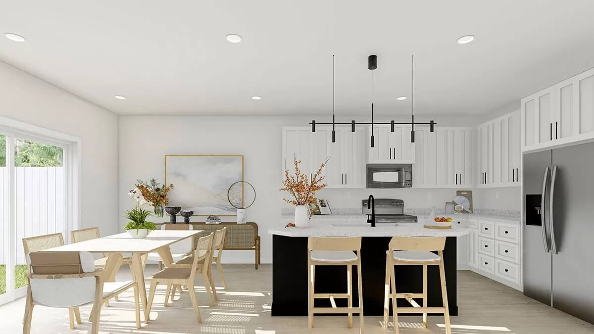 Kitchen and dining area with white cabinets, a breakfast island, and a rectangular dining set.