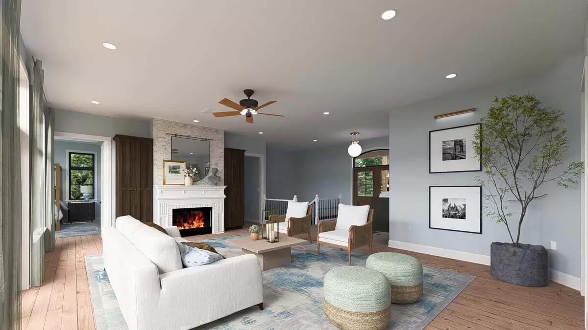 Family room with white seats, round poufs, and a fireplace.