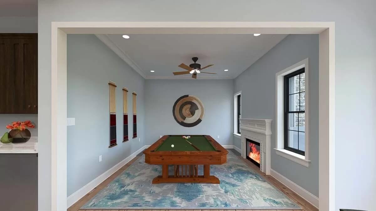 Game room with a billiard's table and a cozy fireplace.