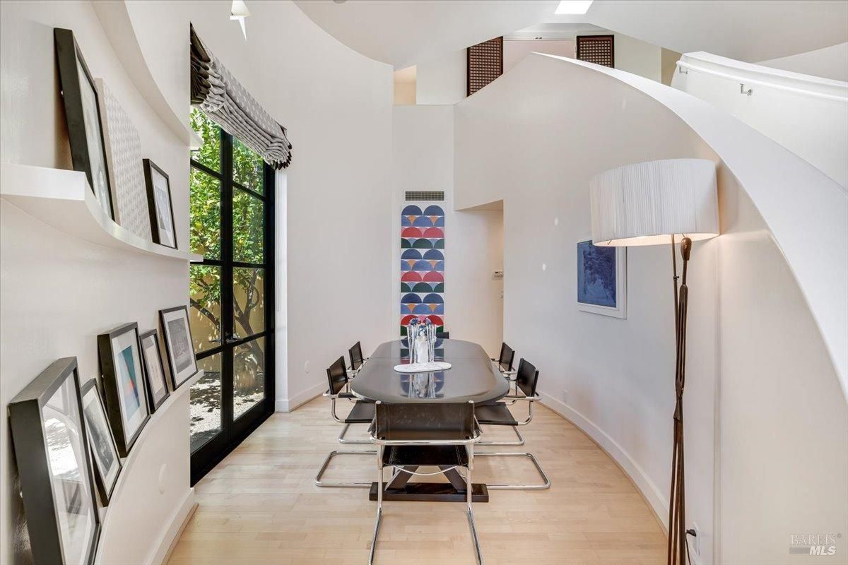 Dining room with French doors and a large table.