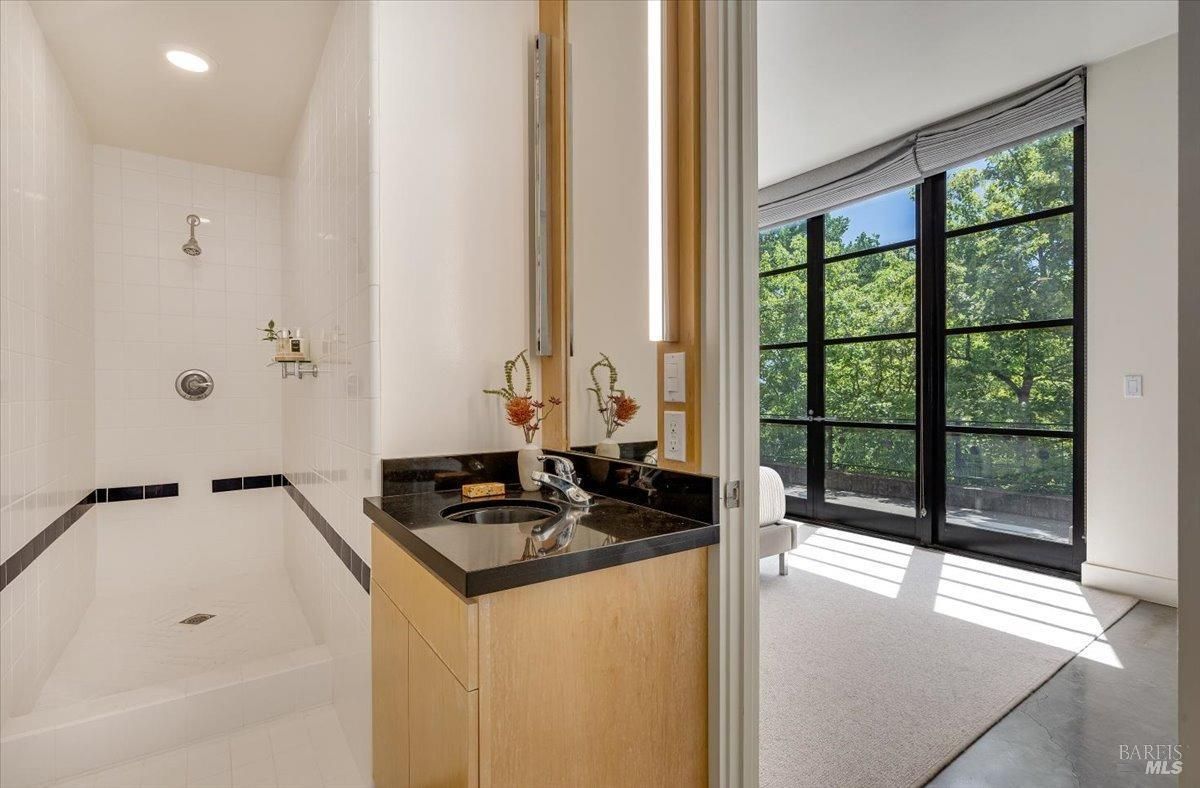 Bathroom with a shower and a sink.