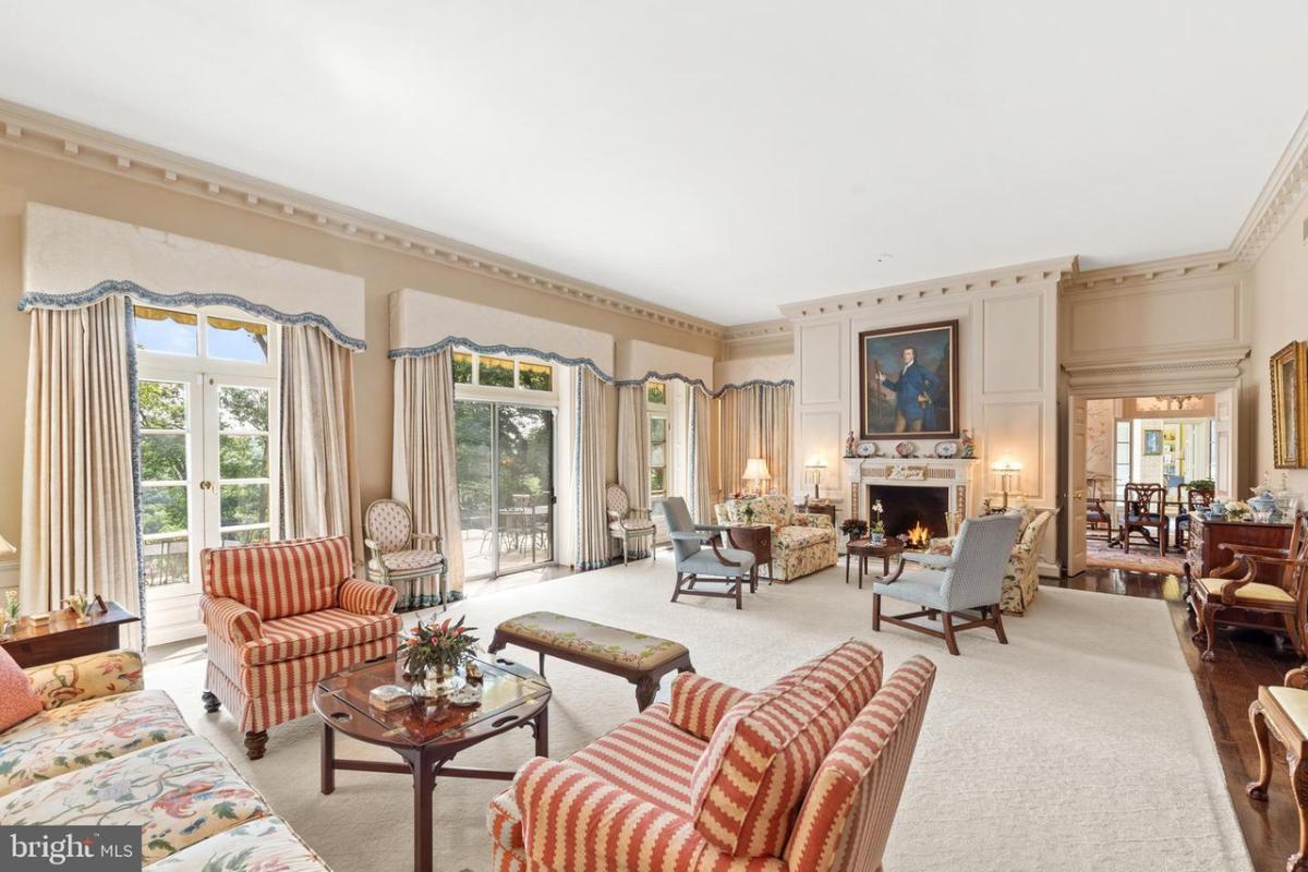 Living room with French doors and a fireplace.