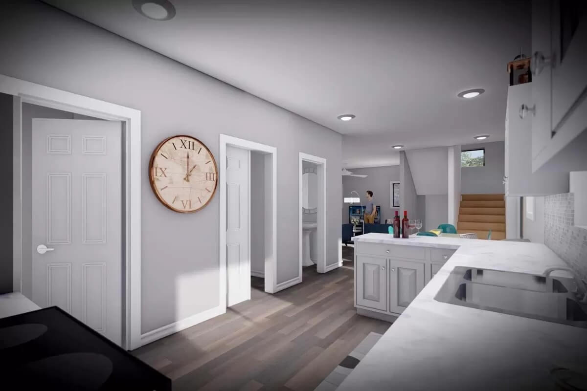 Kitchen with white cabinets, marble counters, and double sinks.