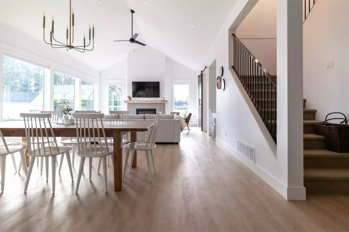 Dining area and great room under a cathedral ceiling.