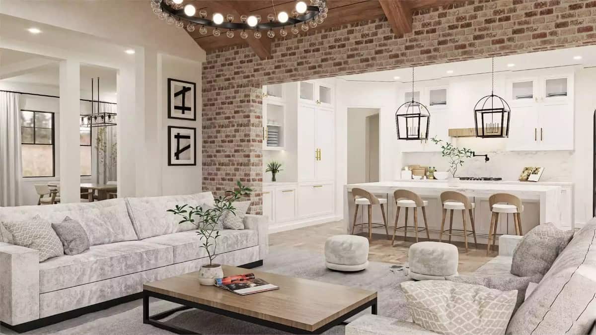 Great room and kitchen connected by a brick opening.