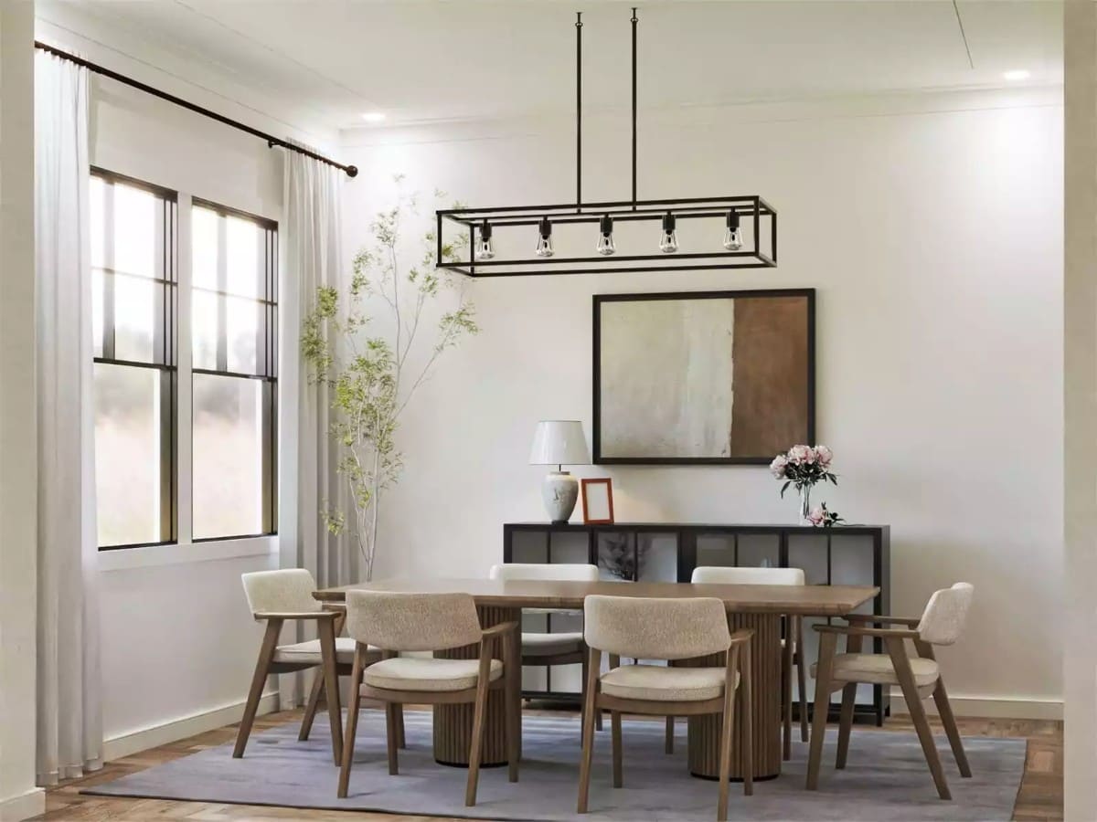 Dining room with a wooden dining set illuminated by a linear chandelier.