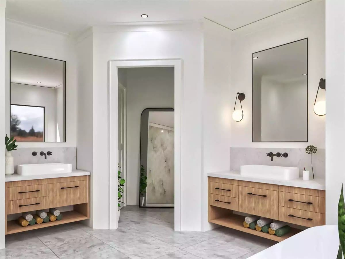 His and her vanities with vessel sinks, wooden cabinets, and large windows.