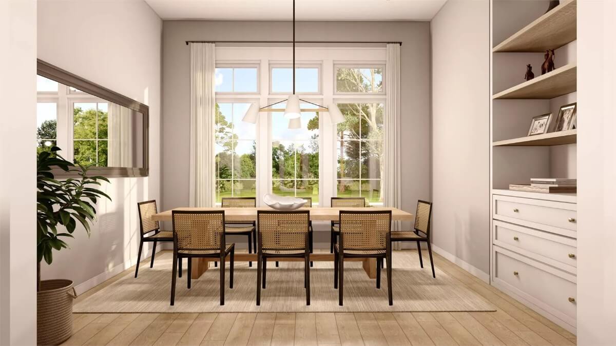 Dining room with a rectangular dining set illuminated by a trio of windows.