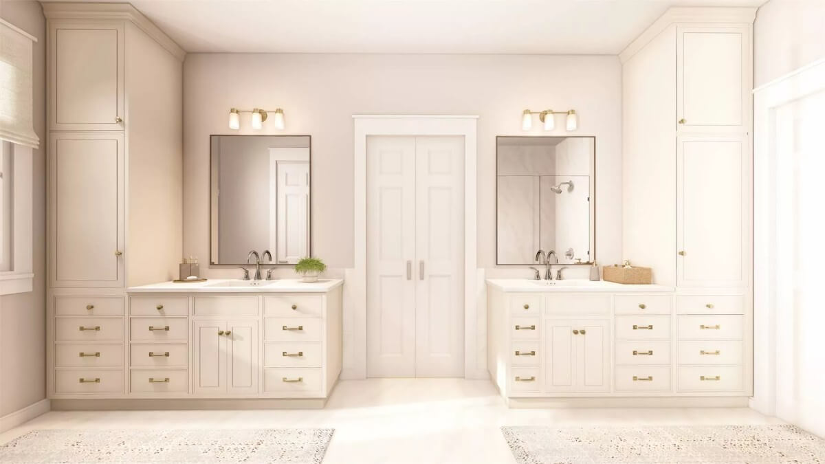 His and her vanities with white cabinets, framed mirrors, and linen closets.