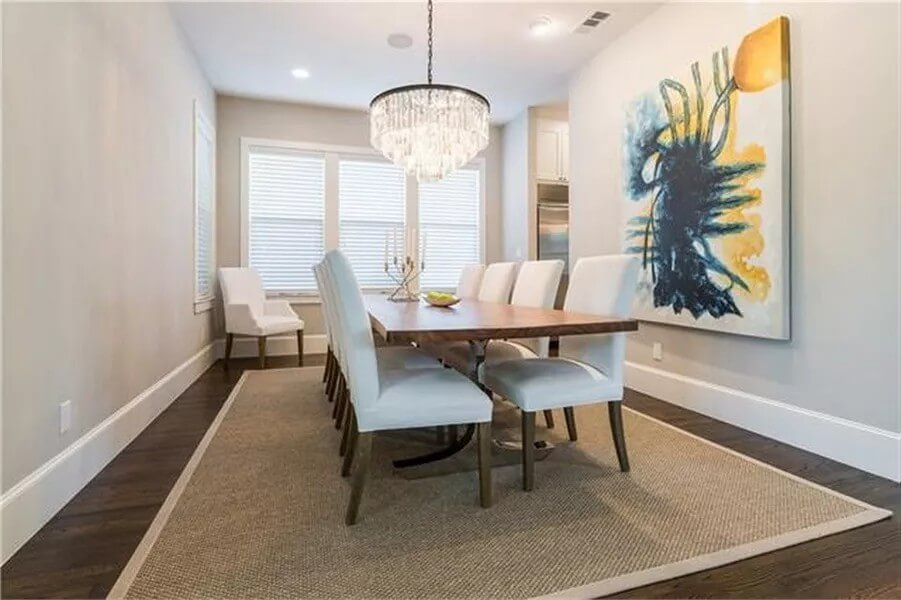 Dining room with a rectangular dining set over the jute area rug.