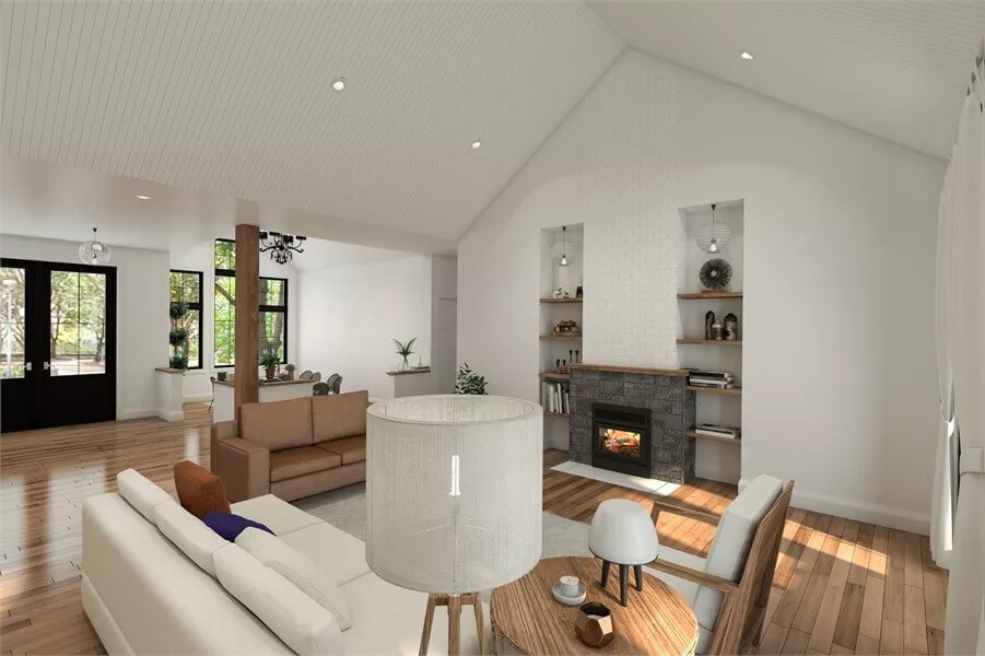 Living room with modern sofas and a stone fireplace flanked by built-in shelves.