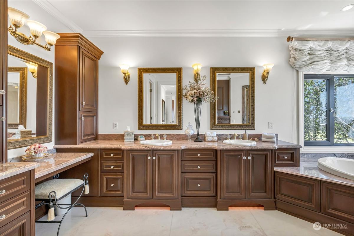 Bathroom with sinks and soaking tub.