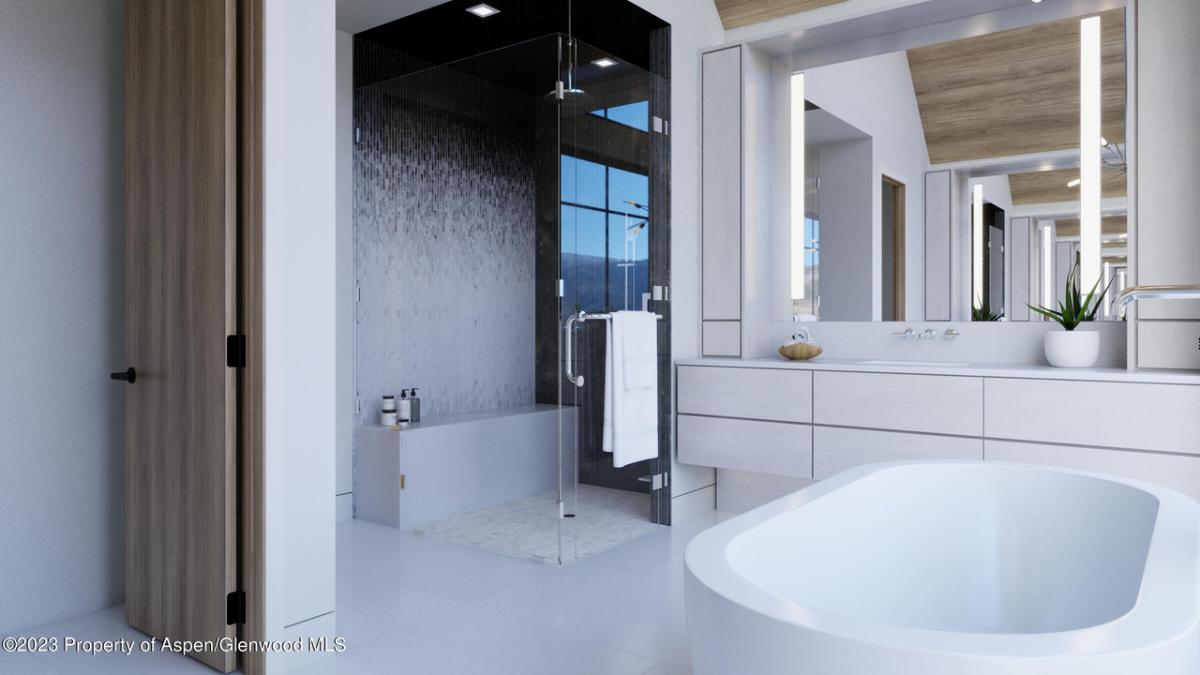 Bathroom with sink, mirror, soaking tub and walk-in shower.