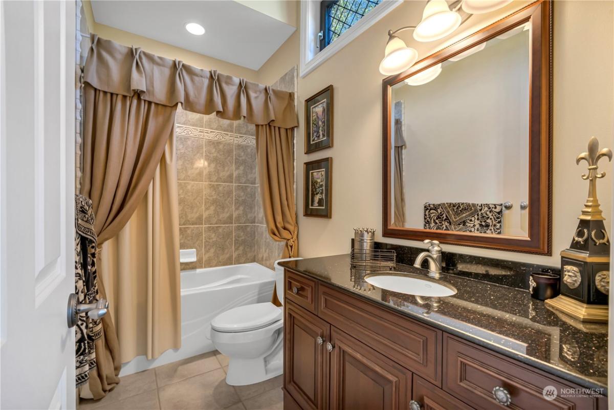 Bathroom with a sink and soaking tub.